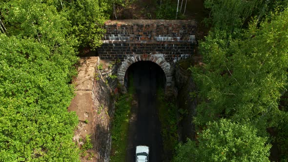 Aerial View of the Car Entering the Tunnel