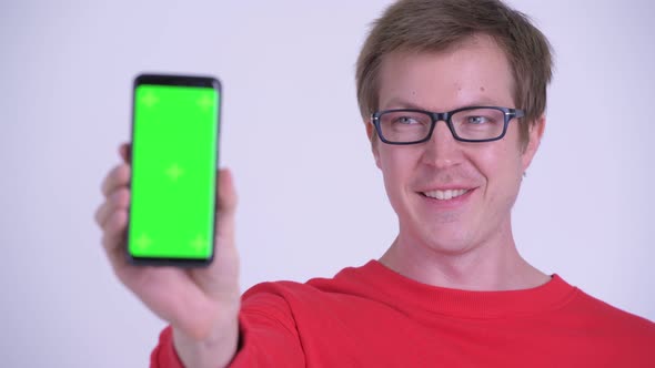 Face of Happy Young Handsome Man Showing Phone