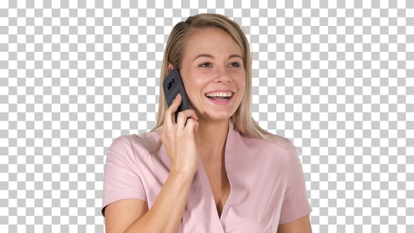 Laughing blonde businesswoman having a funny phone conversation