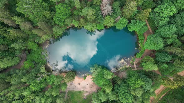 Aerial View of Blue Colored Forest Lake in Poland