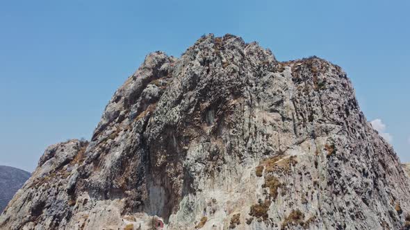 A cinematic shot of Peña de Bernal City and monolith rock formation in Querétaro state of central Me