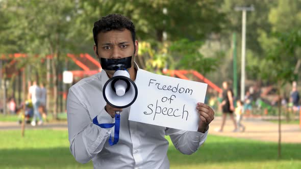 Censored Male Activist Potesting with Megaphone.