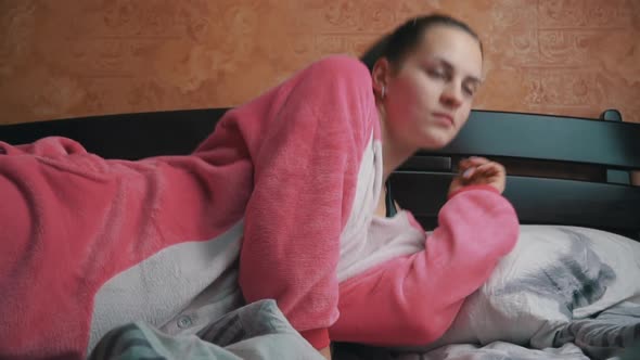 Girl in Pajamas Go to Bed on a Pillow in Slowmo