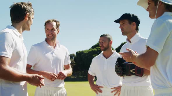 Cricket players into team discussion during cricket match