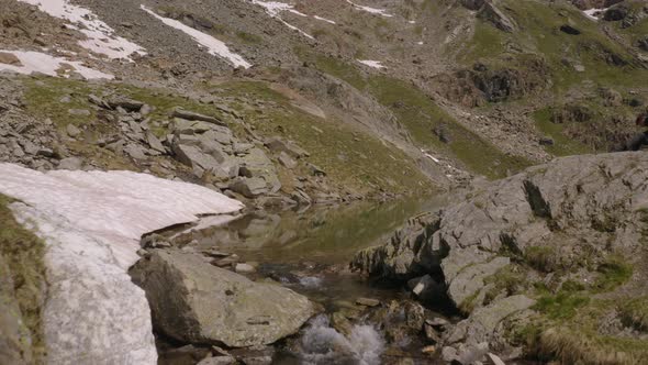 Aerial view of a stream river on Italian Alps, Italy.