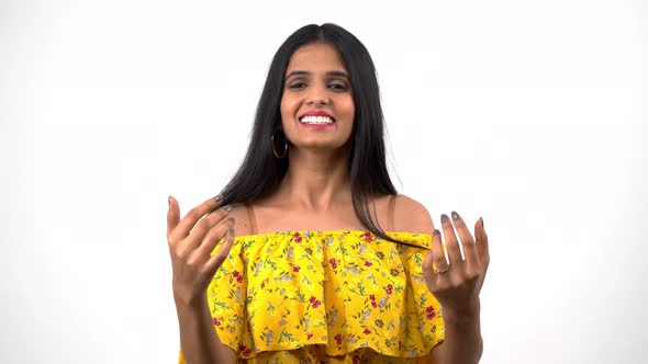 Happy Indian girl inviting someone