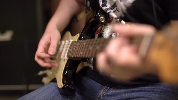 Closeup Playing the Guitar Frame of Hands Playing the Strings