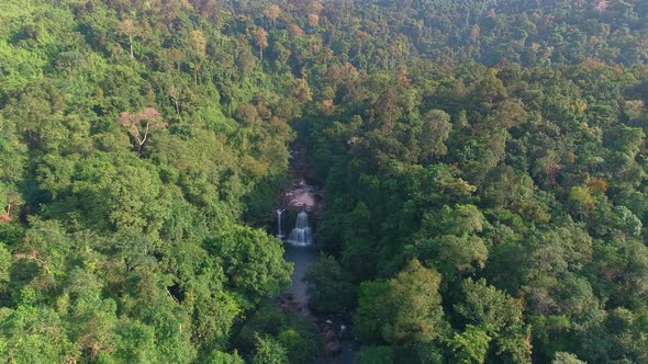 Flight to Waterfall over Jungle Forest