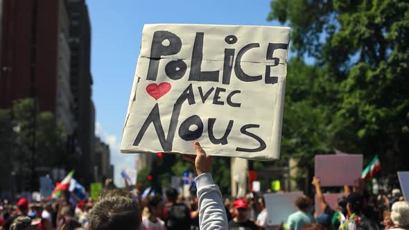 Male Hands Holding Banner in Hand in Protest 