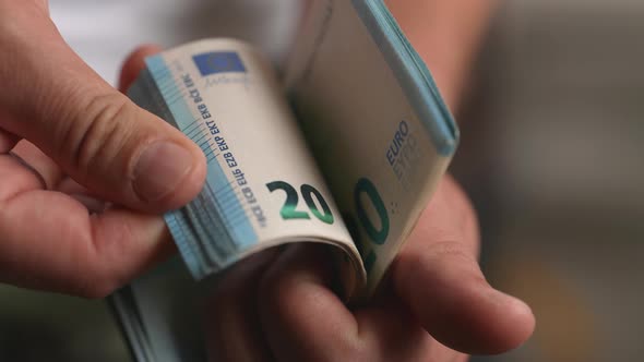 Male Hands Counting Euro Bills