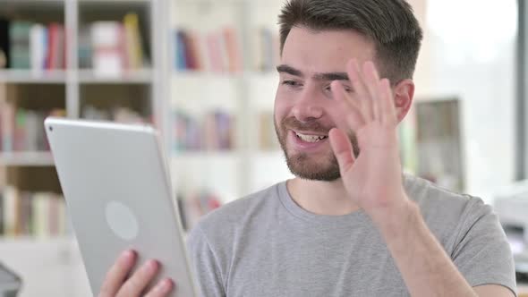 Portrait of Online Video Chat on Tablet By Young Man