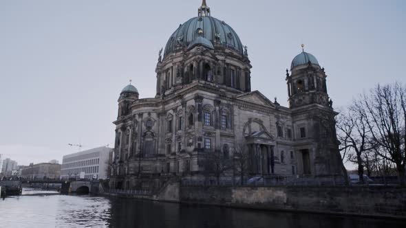 Scenic water view of Berlin cathedral teal patina copper dome roof with Baroque architecture and cem