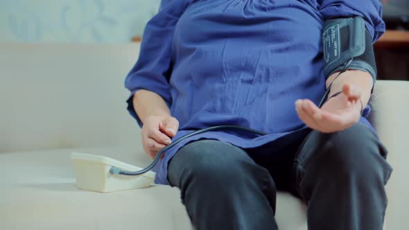 Unhealthy Woman Checking Blood Pressure Hypotension Diagnostic On Medical Tonometer. Measuring Pulse