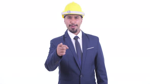 Happy Bearded Persian Businessman As Engineer Pointing at Camera