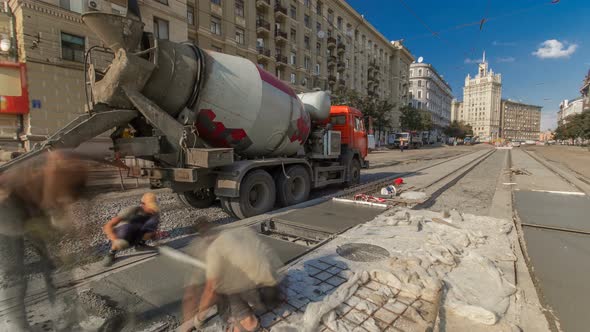 Concrete Works for Road Construction with Many Workers and Mixer Timelapse