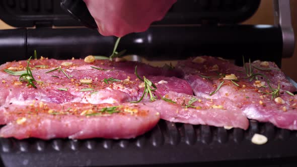 Close-up of Pork Production. Pork Steak Fried on a Grill