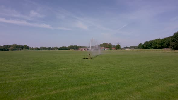 Watering an agricultural field with water sprinkler in area the Achterhoek in the Netherlands