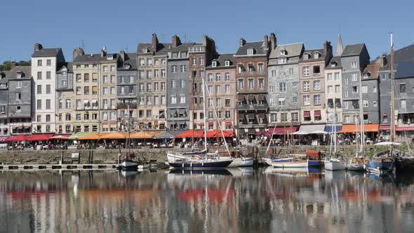 HONFLEUR, FRANCE - SEPTEMBER 2016 Beautiful  architecture reflections on water of famous northern No
