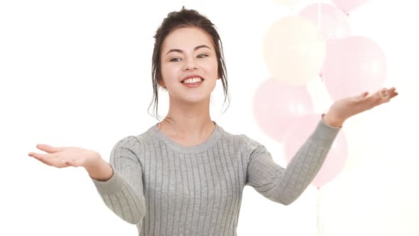 Happy Caucasian Teenager Girl with Brunette Hair Cathing Soap Bubbles in Air and Smiling