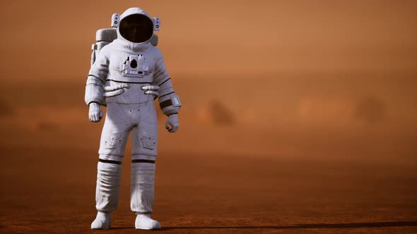 Astronaut on Mars Surface. Red Planet Covered in Gas and Rock