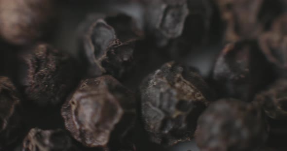 Macro of Peppercorns on a white plate