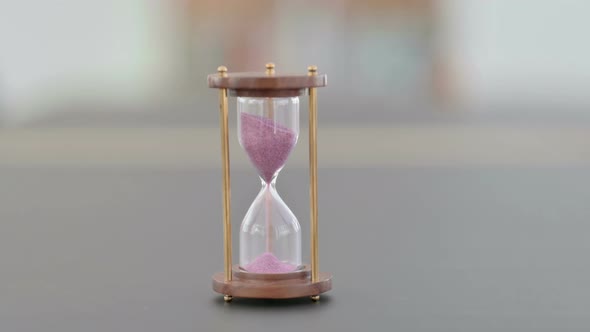 Close Up of Hourglass on Table Sand Clock