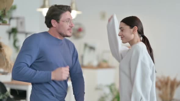 Excited Couple Dancing Together Celebrating