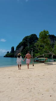 Couple Men and Woman on the Beach of Koh Hong Island Krabi Thailand Asian Woman and European Men on