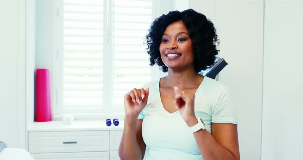 Woman performing stretching exercise at home 4k