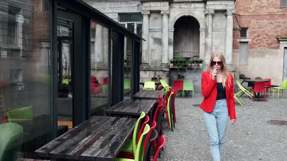 Stylish Young Girl in a City with Vape