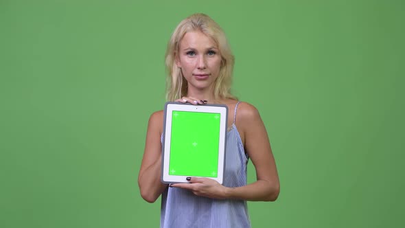 Young Happy Beautiful Businesswoman Showing Digital Tablet