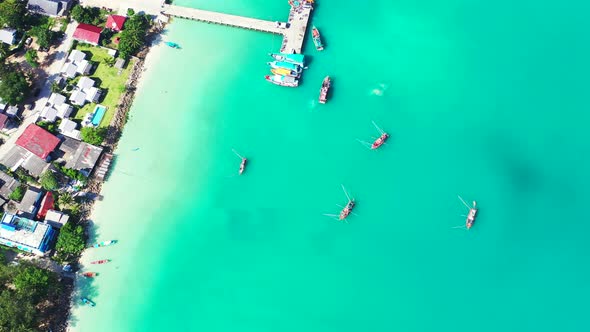 Beautiful drone clean view of a white sand paradise beach and aqua blue ocean background 