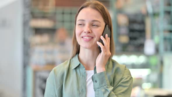 Portrait of Cheerful Woman Talking on Smartphone