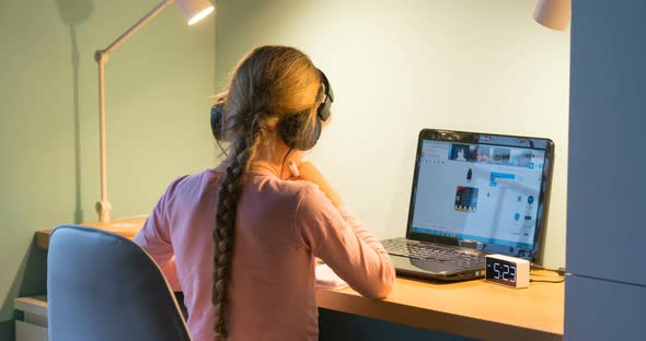 Girl Studying Remotely in Front of Laptop