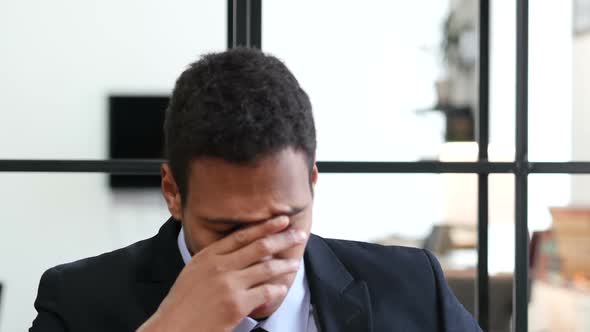 Tired Black Businessman at Work, Confused