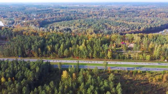 Latvia, A2 Highway Autumn Landscape From Above. Gauja River With Bridge and Ramkalni in Background.