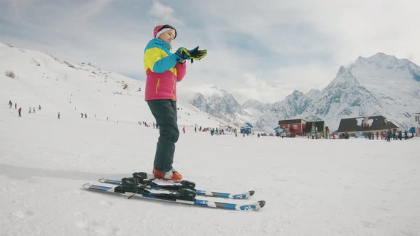 Active Girl Skiing in Mountains. Ski Race for Young Children. Little Skier Racing in Snow