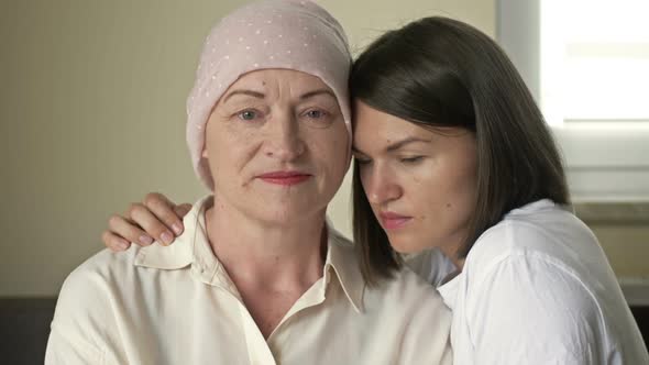 Young Woman Hugs Her Sick Mom After Chemotherapy