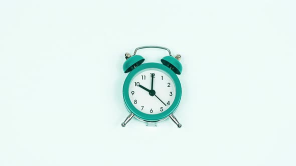 Stop Motion Alarm ClockStop motion footage of alarm clock ringing on white background