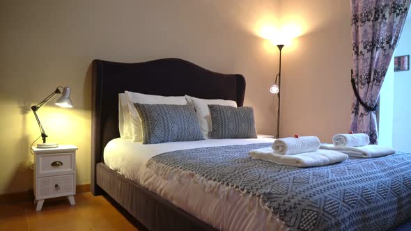 Zoom in on Pillows Placed on Bed in a Naturally Well Lit and Tidy Modern Bedroom