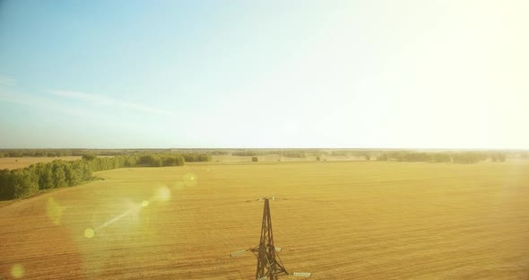 Vertical Movement Flight Near High Voltage Electricity Tower and Power Lines at Green and Yellow