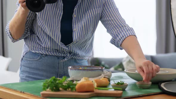 Food Photographer with Camera Working in Kitchen