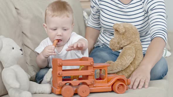 Curious Toddler Playing with Toys