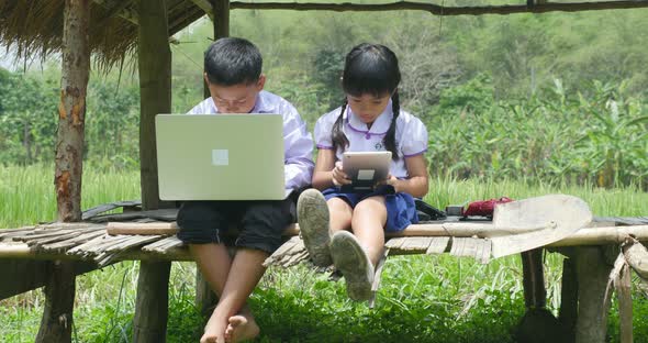 Boy and Girl Studying Online