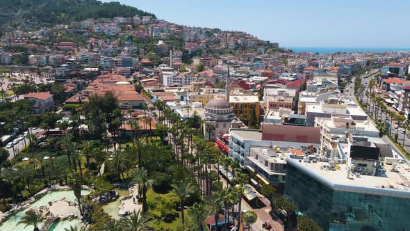 Residential buildings and houses in Alanya. Resort city with mountains on background. Panorama view