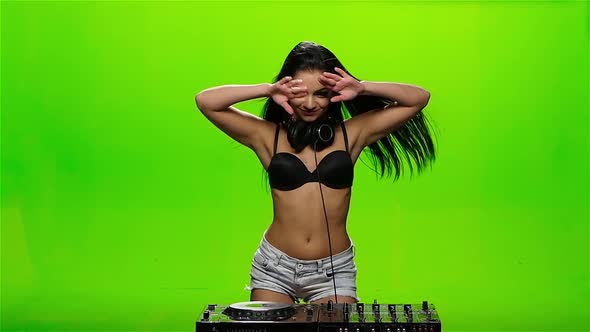Girl DJ Makes Erotic Movements with His Hands. Green Screen. Slow Motion