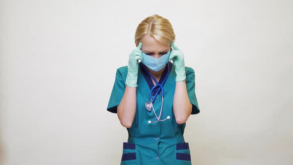 Medical Doctor Nurse Woman Wearing Protective Mask and Rubber or Latex Gloves - Headache and Stress