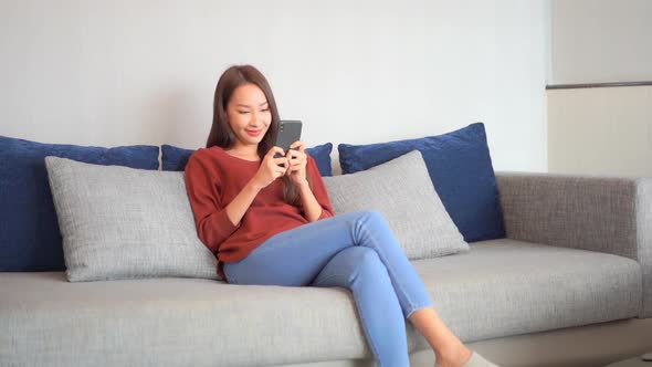 Young asian woman use smart phone