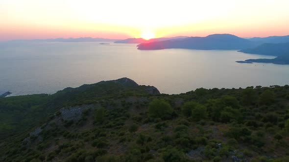 Morning Sunrise Over Forested Hills on the Seashore