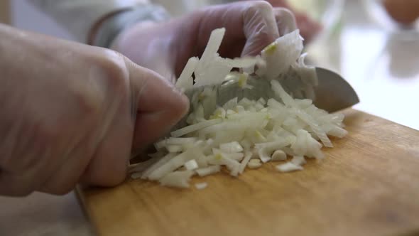 Cutting white onion.